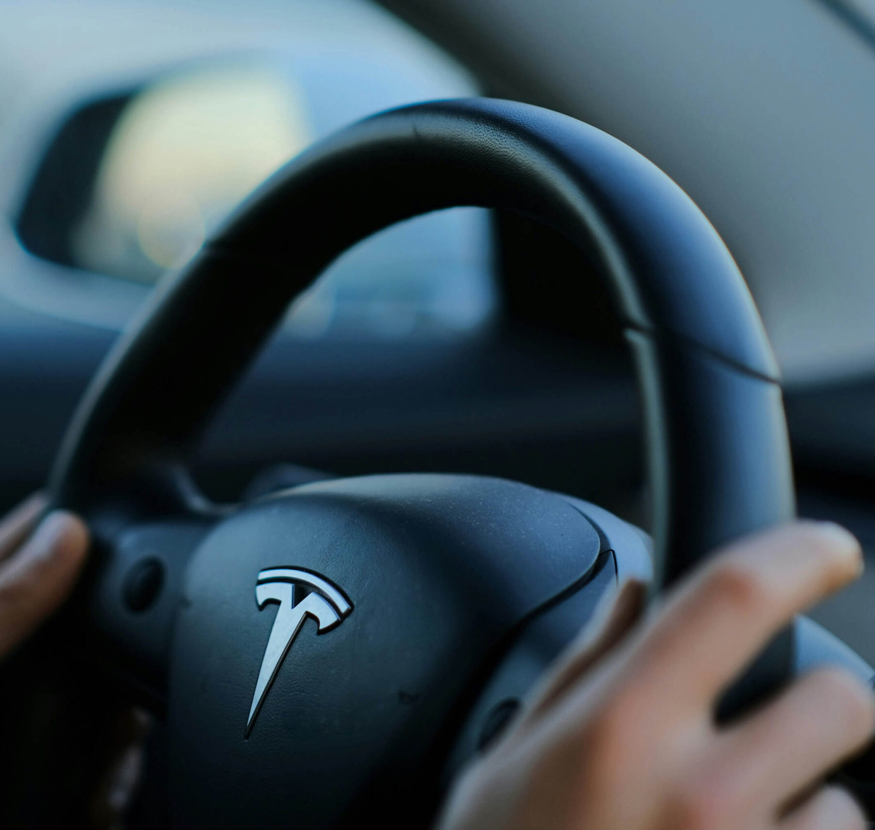 Someone steering an EV